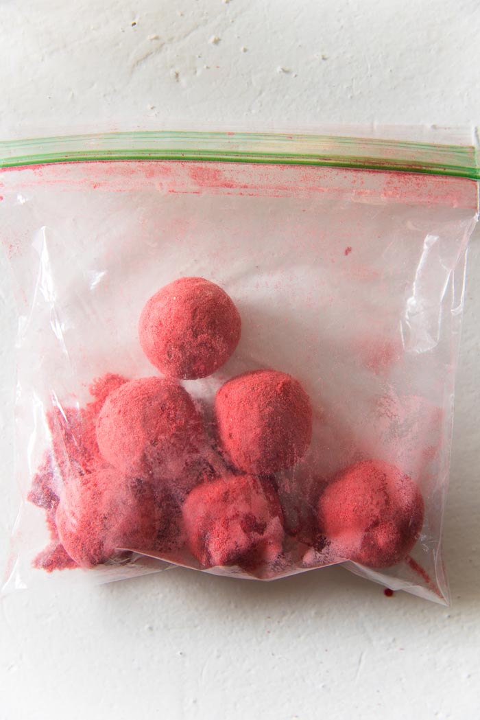 An easier way to coat chia bliss balls with freeze dries fruit powder - Place the fruit powder and bliss balls in a plastic bag - Seal and shake until coated well. 