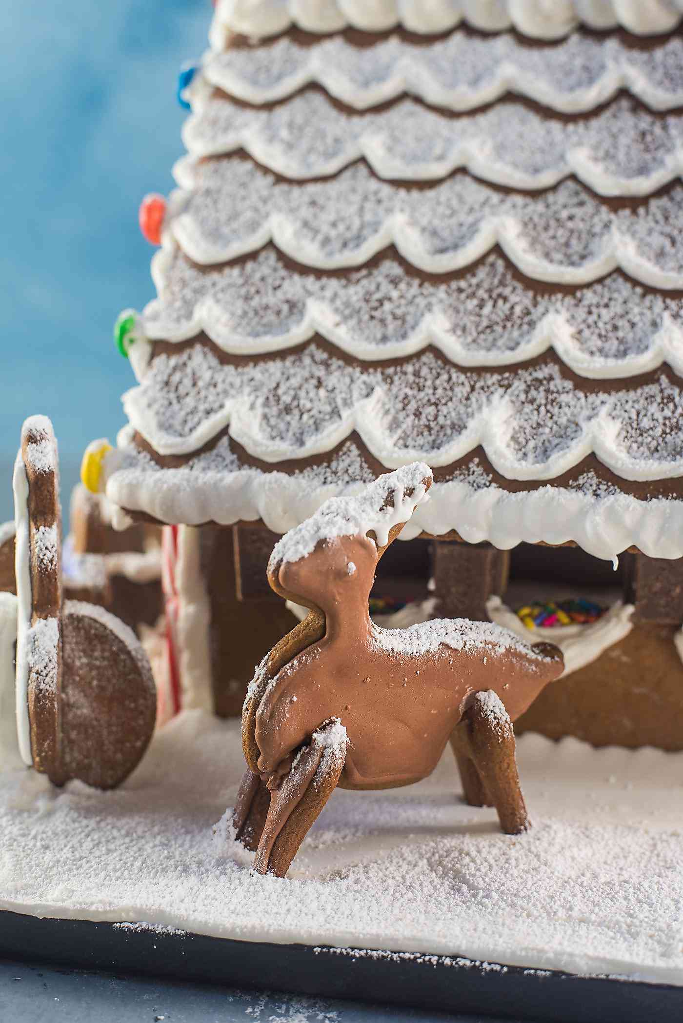 Gingerbread House - Get the perfect gingerbread dough recipe to make this adorable gingerbread house or your favorite cutout Christmas cookies! You can get your hands on this easy, printable gingerbread house template too. 