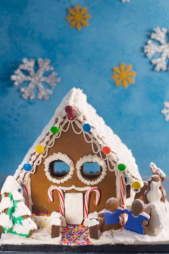 Gingerbread House - Get the perfect gingerbread dough recipe to make this adorable gingerbread house or your favorite cutout Christmas cookies! You can get your hands on this easy, printable gingerbread house template too. 