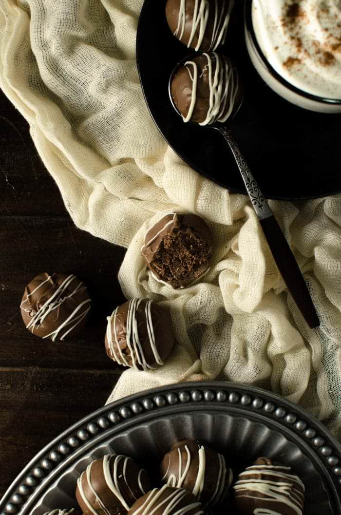 Deliciously Intense Dark Chocolate Rum Balls - Super boozy, dark chocolate truffle like Rum Balls made with digestive cookies or graham crackers and a whole lot of Rum! These are Dairy free friendly (and vegan friendly) and an excellent and easy edible gift choice! There's a reason why these are so popular!
