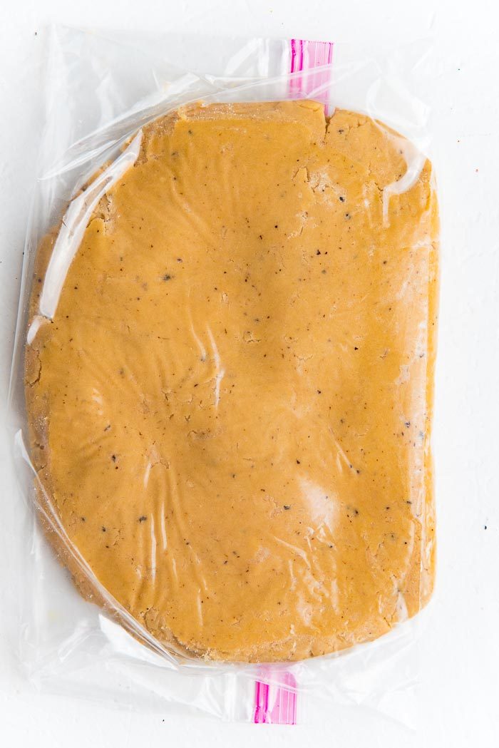 Speckled shortbread dough inside a ziploc bag before rolling it out