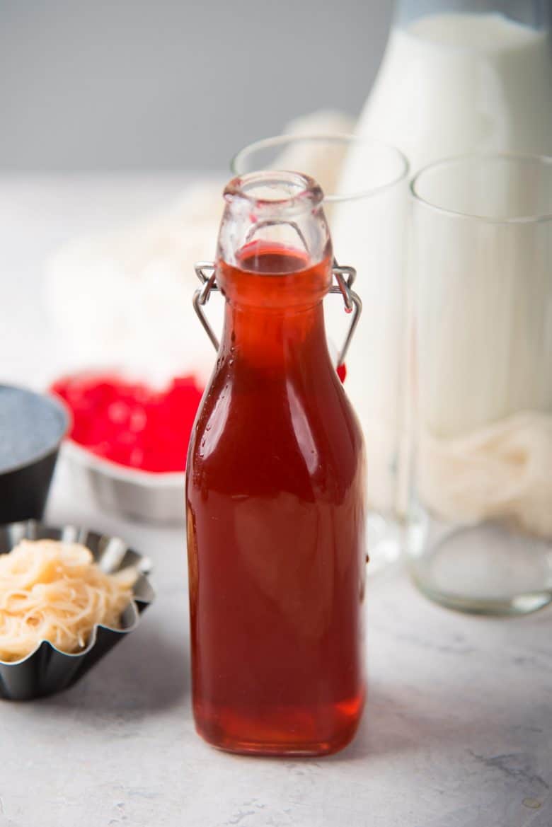 A bottle of homemade falooda syrup, to make rose and vanilla milkshake