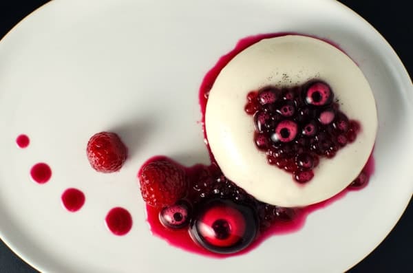 White Chocolate Panna Cotta with Hibiscus Syrup Pearls. Hibiscus pearls made using Reverse Spherification, but can be served without spherification as well. Sweet, creamy perfectly "jiggly" panna cotta with delicious sweet, citrusy hibiscus with hints of raspberry!