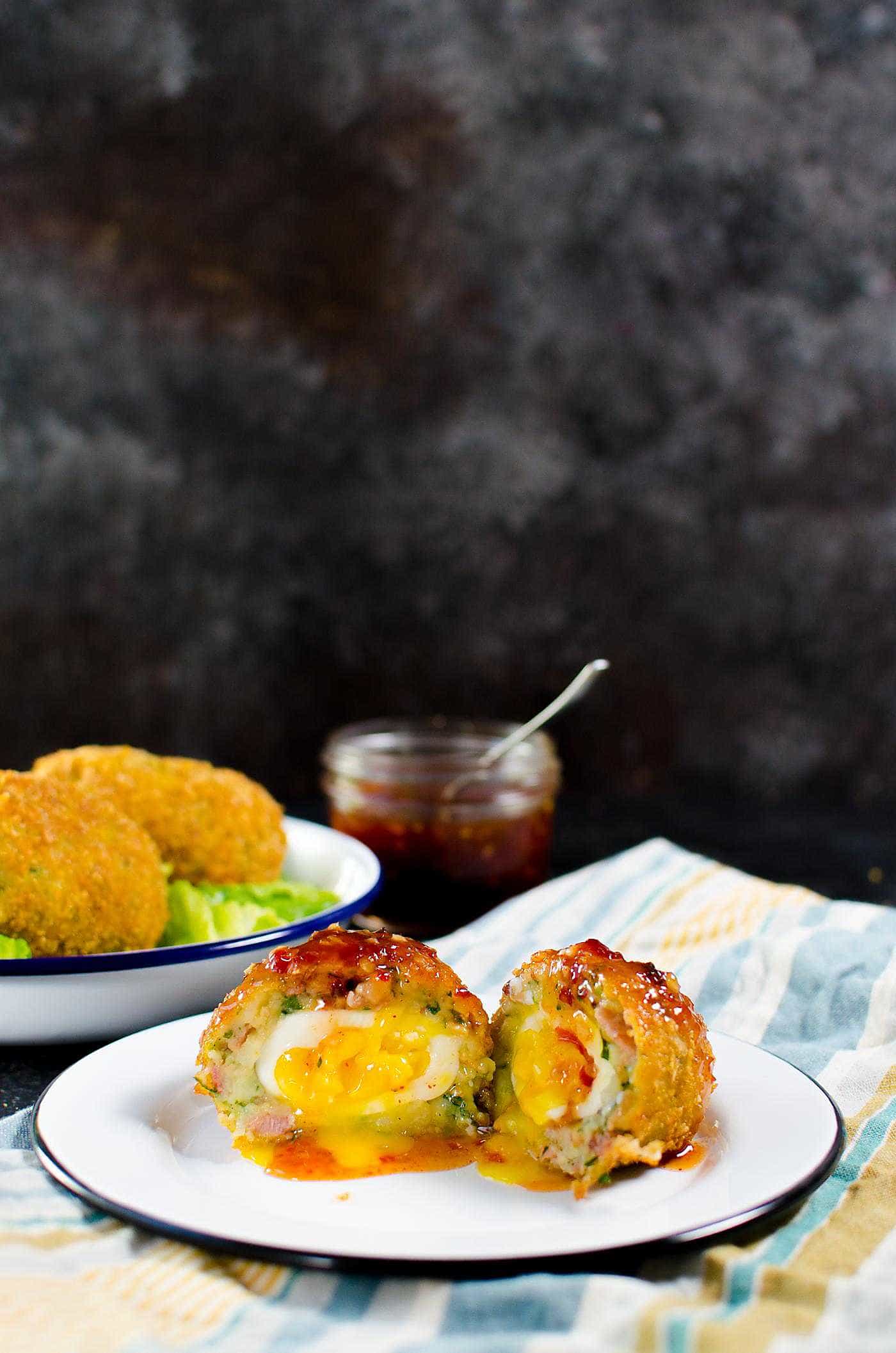 Cheesy Potato & Bacon Scotch Eggs. Extra special Breakfast Scotch eggs with Cheese, Potato, Bacon! Perfect Brunch or Breakfast Eggs.