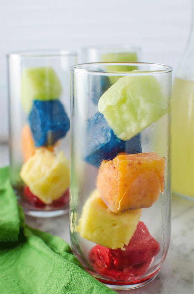 Rainbow Ice Cubes - Make your drinks like your favourite lemonade, fun with these Rainbow Ice Cubes all made with natural colours and flavours to add more fruityness to your rainbow lemonade! 