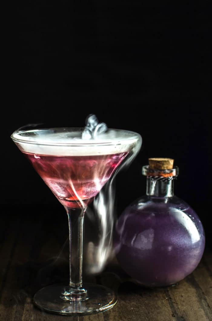 The Witch's Heart - This shimmery Purple and Red cocktail is the perfect halloween cocktail or party cocktail! Easy to make and tastes delicious!