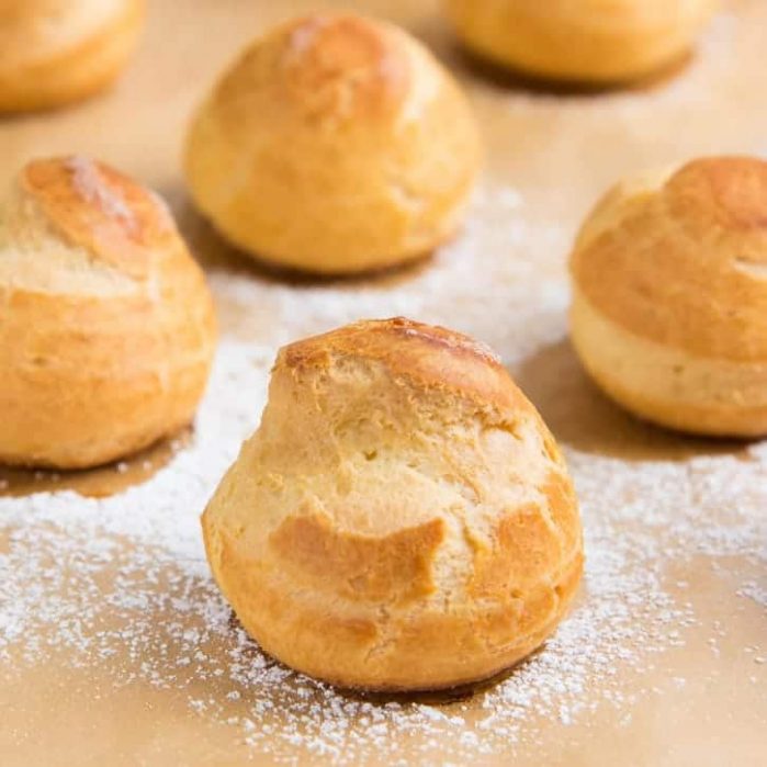 Learn how to make Perfect Choux Pastry (Or Pate a Choux!) - The only recipe guide you will ever need to make choux pastry, with perfect results every time. Plus a troubleshooting guide for your choux pastry recipe.  Fool proof choux pastry to make profiteroles, eclairs, cream puffs and more.  #ChouxPastry #Profiteroles #Eclairs #Pastry #CreamPuffs
