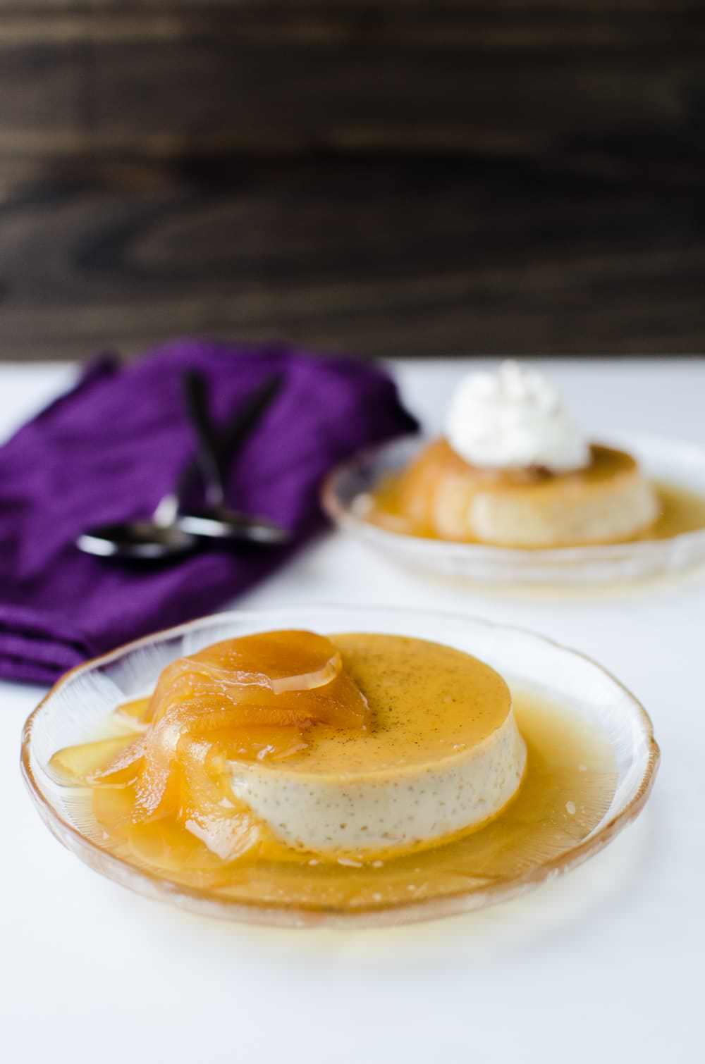 Poached Apple and Cinnamon Creme Caramel (Poached Apple and Cinnamon Flan) - A decadent, creamy dessert. Easy to make, and a perfect make ahead dessert! A delicious twist on the classic Creme Caramel with Americas favourite Apple and Cinnamon