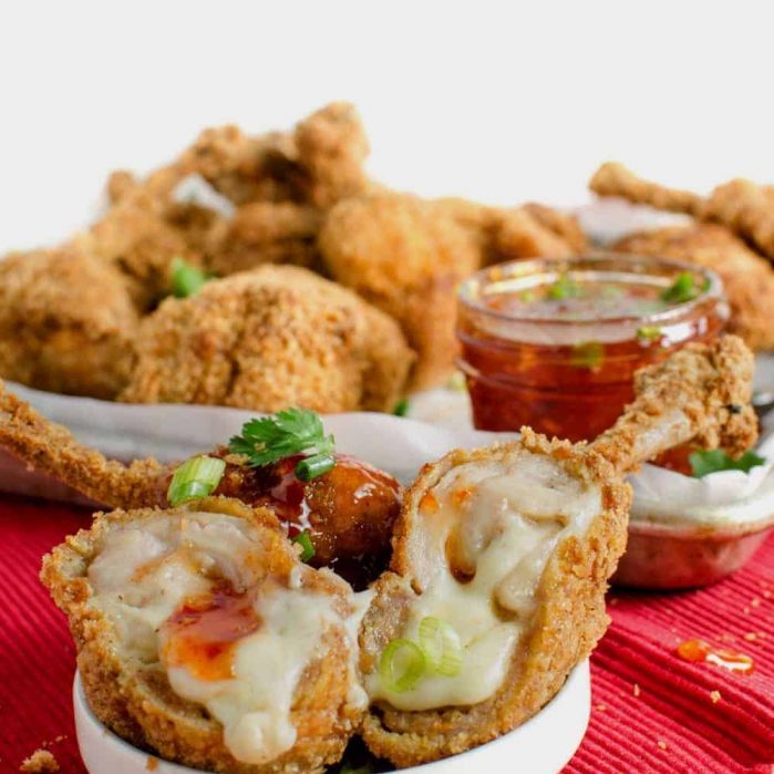 Boneless Cheese Stuffed Chicken Wings - These are no ordinary Chicken Wings! These are boneless Chicken wings STUFFED with gooey melted cheese AND Pork (or chicken)!. These Boneless Cheese Stuffed Chicken wings are indescribable and absolutely delicious!