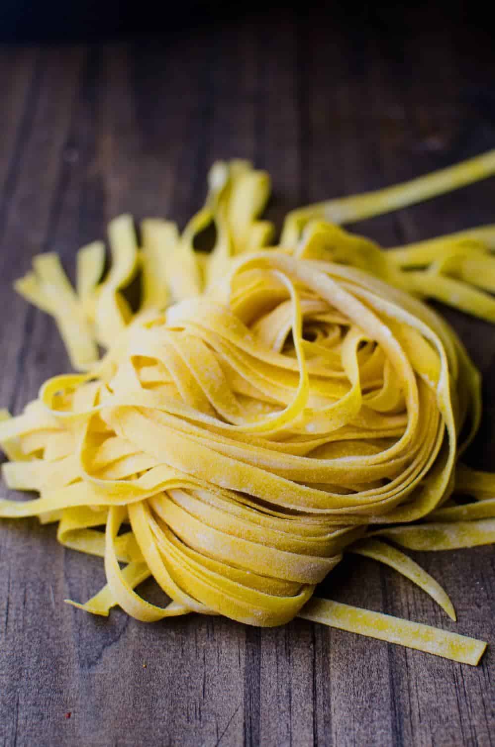 Homemade Turmeric Pasta - Bright yellow, smokey turmeric infused into homemade pasta dough. Fun to make and gives your pasta a delicious smoky flavor with a pleasant, slight bitterness.
