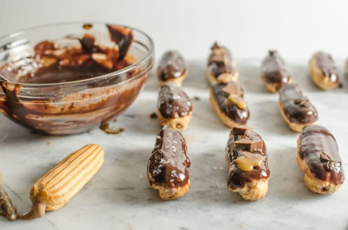 Perfect Mini Chocolate Eclairs with Coffee Creamer Creme Patissiere. Absolutely delicious, easy pastry cream made with Coffee-Mate® Chocolate Boutique Coffee Creamer, inside a perfect mini Eclair shell. #SipIndulgence with these delicious treats!