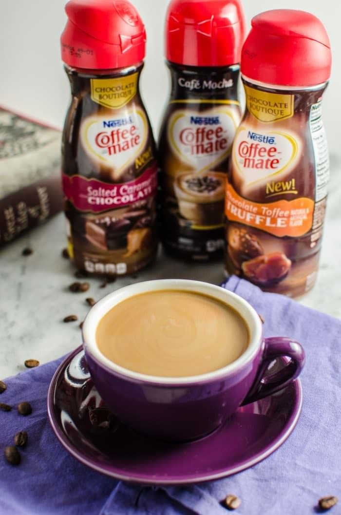 Perfect Mini Chocolate Eclairs with Coffee Creamer Creme Patissiere. Absolutely delicious, easy pastry cream made with Coffee-Mate® Chocolate Boutique Coffee Creamer, inside a perfect mini Eclair shell. #SipIndulgence with these delicious treats!