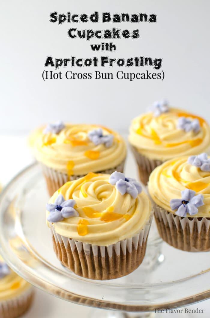 Spiced Banana Cupcakes with Apricot Frosting - These super moist, delicious cupcakes have a hint of spice and are studded with raisins with a buttery White Chocolate, Apricot frosting! Easy to make and every bit as delicious as Hot Cross Buns (if not more!) (Video + Recipe)
