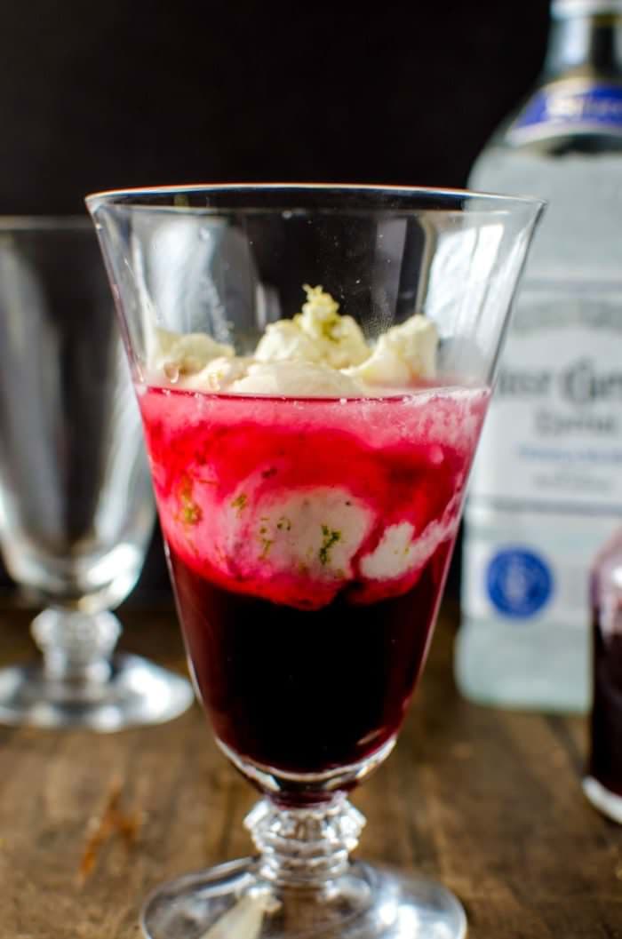 Hibiscus Strawberry Margarita Ice Cream Float - Take your Margaritas to the next level with this simple and delicious twist! Sweetened with a Hibiscus and Strawberry Syrup, plus tequila and a generous scoop of Salted Lime Sherbet this Ice Cream float is the PERFECT treat for Cinco de Mayo or any party! REPIN to save. CLICK to get the recipe! #TheFlavorBender