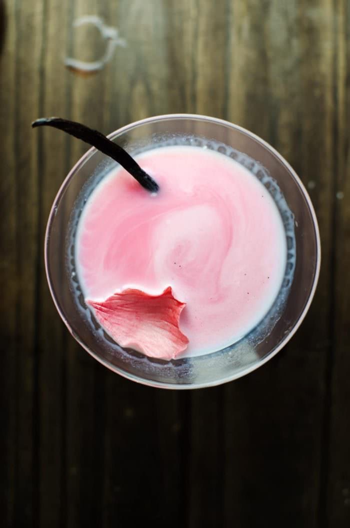 Vanilla Rose and White Chocolate Cocktail - This cocktail is one delicious, sweet decadent cocktail with beautiful floral flavours and a spectacular look! An inspired Falooda Cocktail with exotic flavours and an edible floral decoration! REPIN to save! CLICK to get the recipe now. #TheFlavorBender