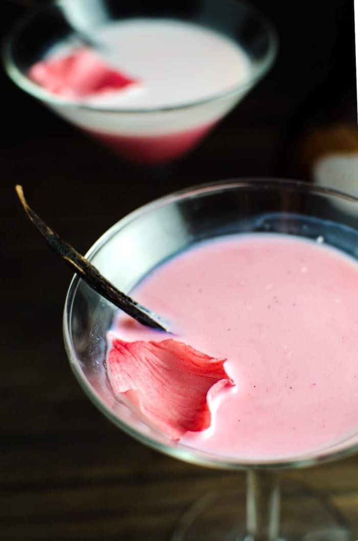 Vanilla Rose and White Chocolate Cocktail - This cocktail is one delicious, sweet decadent cocktail with beautiful floral flavours and a spectacular look! An inspired Falooda Cocktail with exotic flavours and an edible floral decoration! REPIN to save! CLICK to get the recipe now. #TheFlavorBender