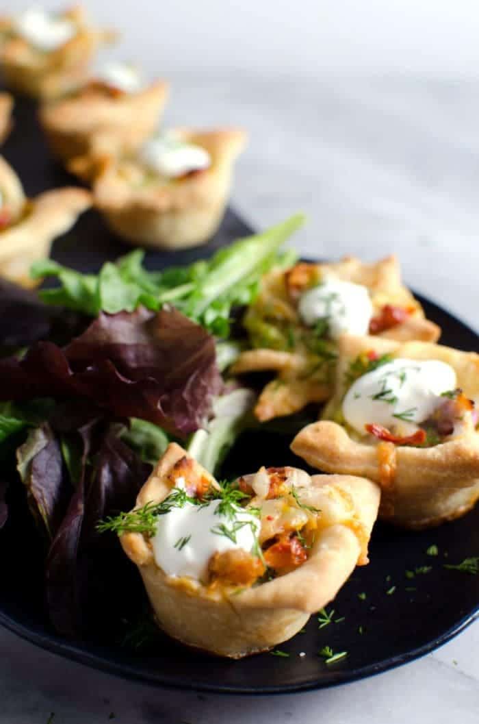 Tuna Melt Mini Quiches - Tuna melts made into bite sized party appetizers! By using delicious Sustainable Solid Tuna like #WildSelections you KNOW it's going to taste even better! REPIN to save. CLICK to get the recipe. #TheFlavorBender
