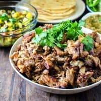 Tequila Braised Slow roasted Pork Carnitas - These Pork Carnitas have been braised in a flavor packed liquid in the oven! It is unbelievably juicy and melts in your mouth that you might not want to share it. Perfect for Tacos, Burritos, Enchiladas, Tostadas, or any Tex mex Party! REPIN for later. CLICK to get the recipe. #TheFlavorBender