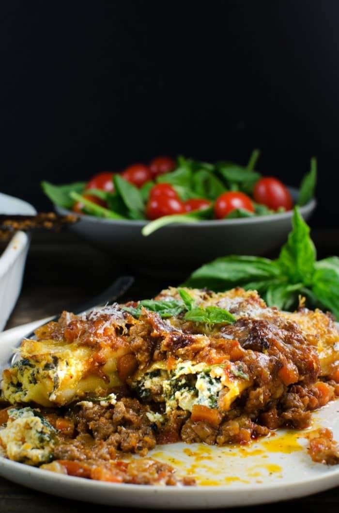 Delicious Beef Cannelloni - Creamy, herby, cheesy ricotta filling stuffed in pasta shells and baked in a hearty beef bolognese and topped with delicious Parmesan! The perfect family meal and easily freezable! #PickedAtPeak #ad. SAVE to repin recipe. CLICK to get the recipe! #TheFlavorBender
