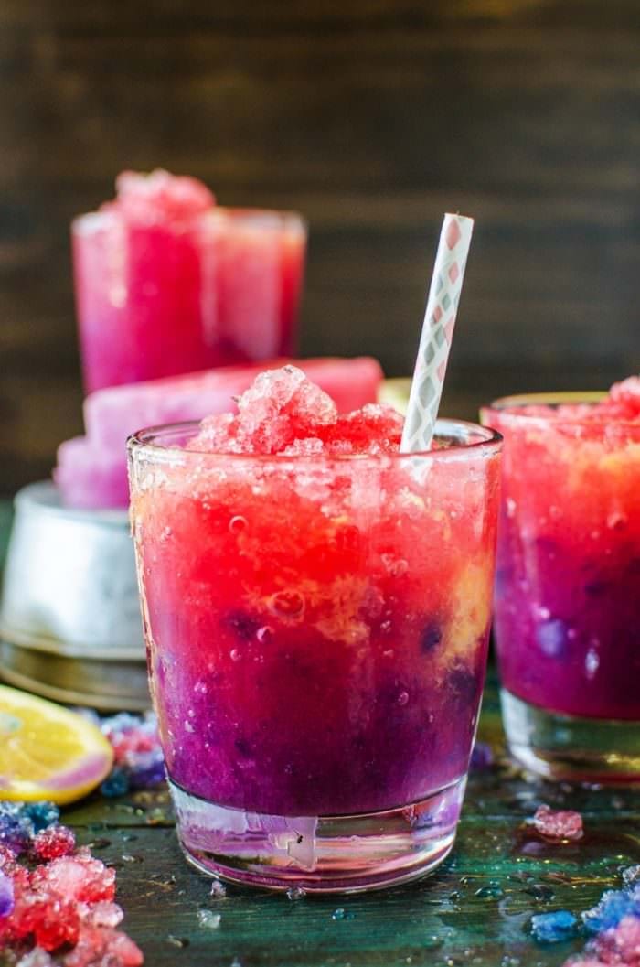 Color Changing Purple and Pink Lemonade Slushies & Popsicles - These kid friendly treats are as magical as they are delicious! You kids will absolutely LOVE these! Have fun with your food while you cool down this summer with these beautiful naturally colored, homemade, color changing lemonade slushies!