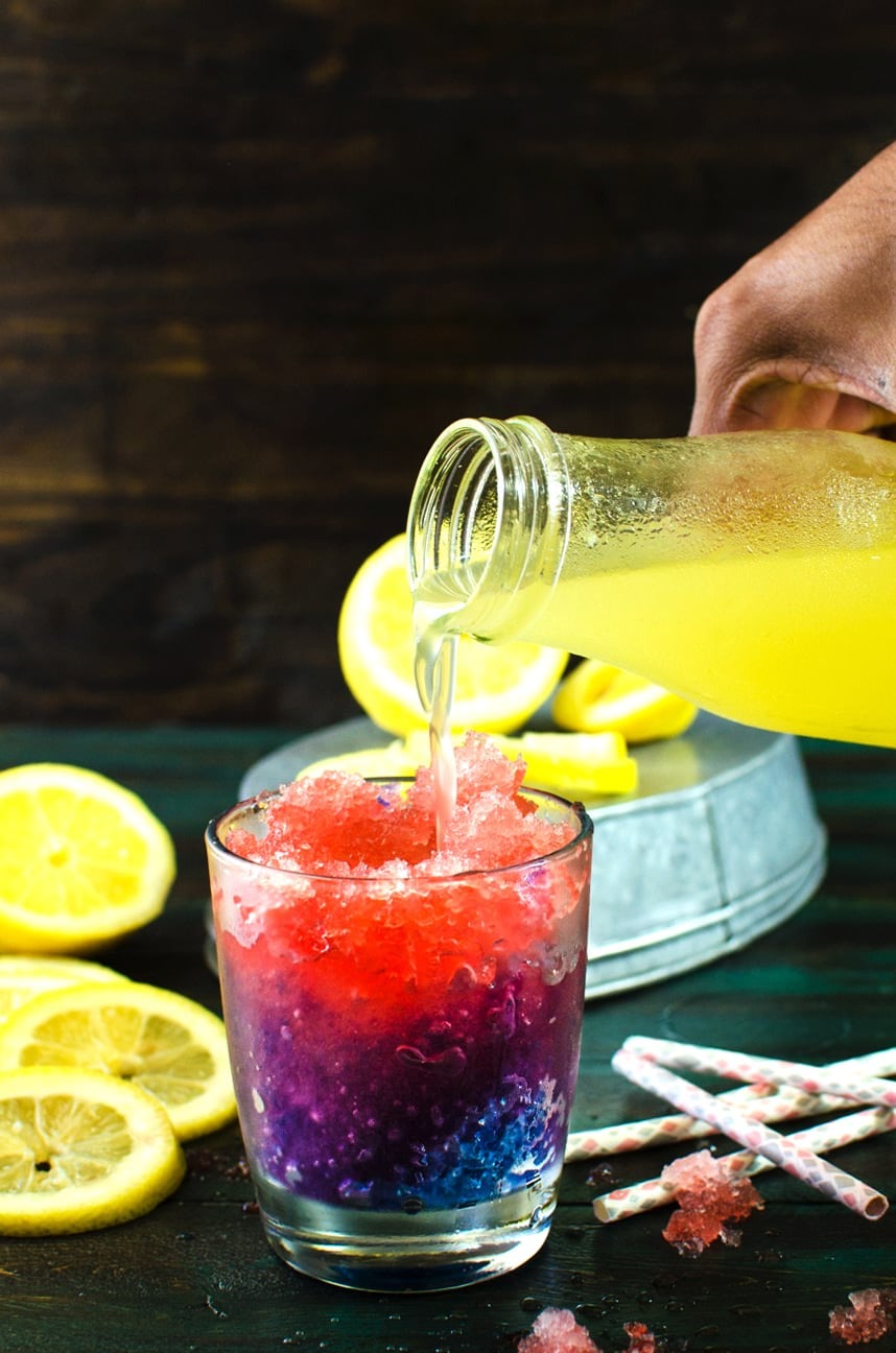 Color Changing Purple and Pink Lemonade Slushies & Popsicles - These kid friendly treats are as magical as they are delicious! You kids will absolutely LOVE these! Have fun with your food while you cool down this summer with these beautiful naturally colored, homemade, color changing lemonade slushies!