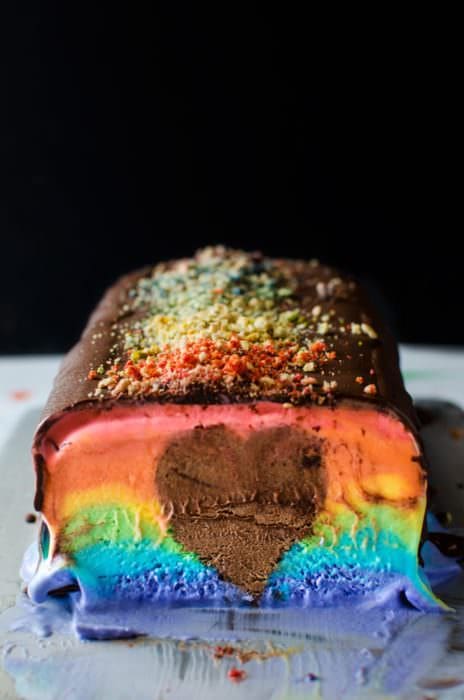 Rainbow Ice Cream Slice with a Hidden Surprise - A deliciously creamy rainbow ice cream slice in bright rainbow colors with a rich, creamy, heart-shaped chocolate mousse center! A fabulous no bake Summer dessert to share with all the people that we love in our lives. SAVE to repin. CLICK to get RECIPE + VIDEO
