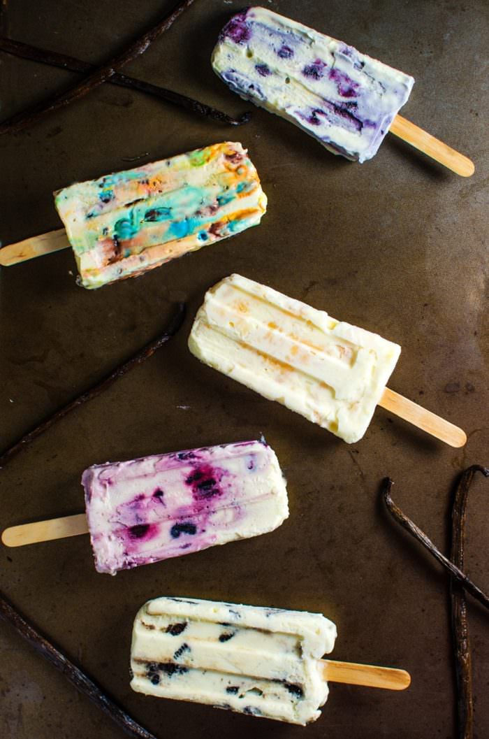 Easy Creamy Vanilla Popsicles in 5 awesome flavors - A easy, delicious vanilla popsicle base flavored in 5 ways to make 5 different popsicles! Insanely delicious, easy and your family will absolutely love it! RECIPE+VIDEO. SAVE to repin. CLICK to get the recipe. #TheFlavorBender
