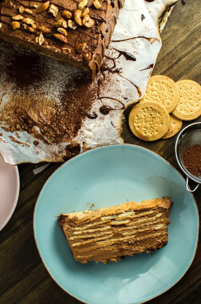 Eggless Chocolate Biscuit Pudding (No Bake Chocolate Cookie Cake) - An easy, classic Sri Lankan dessert with alternating layers of milk-soaked Maria cookies and soft, creamy chocolate buttercream.