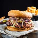 Nashville spicy chicken sandwich showing the crispy fried chicken, coleslaw and pickles between sandwich buns.