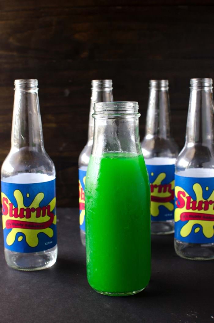 Homemade Slurm Drink from Futurama - sweet, tart, refreshing sparkling limeade with the spicy warmth of ginger! Kids will love the bright green shade and the sweet and tart ginger limeade, or spike it with some vodka for the adults.