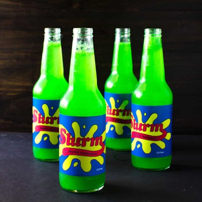 Homemade Slurm Drink from Futurama - sweet, tart, refreshing sparkling limeade with the spicy warmth of ginger! Kids will love the bright green shade and the sweet and tart ginger limeade, or spike it with some vodka for the adults.