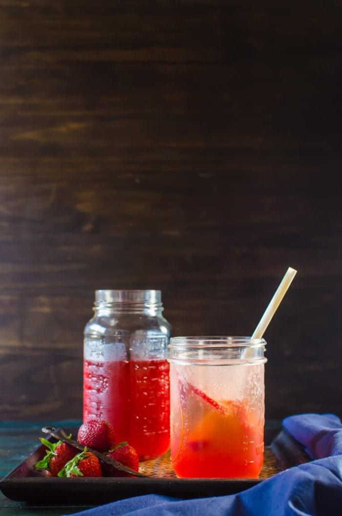 Vanilla Strawberry Shrub Syrup - Make the most of your seasonal strawberries with this delicious syrup! Overripe strawberries, apple cider vinegar, sugar and vanilla are all you need for this bright, pick-me-up drinking vinegar recipe for a hot summer day! SAVE to repin. CLICK to get the recipe. #TheFlavorBender