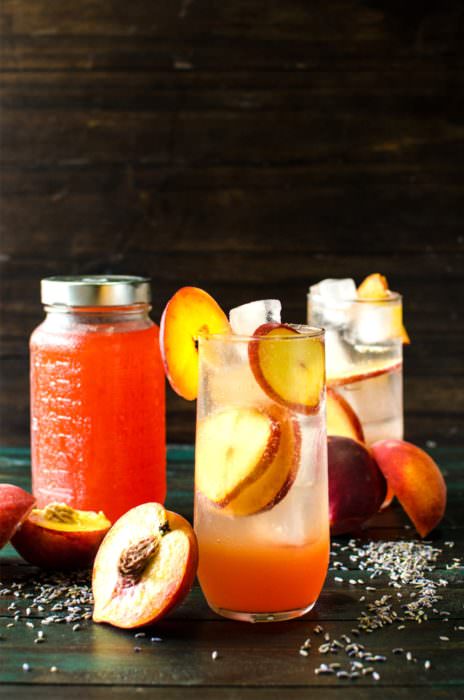 Lavender Peach Shrub Syrup - This sweet, fruity, tangy, floral Lavender Peach Shrub Syrup is simple to make and is a great way to use up bruised, overripe peaches. Mix with ice cold water for a refreshing, non-alcoholic summer drink, or with some vodka or tequila for a delicious cocktail, or with some champagne for a wonderful mimosa!