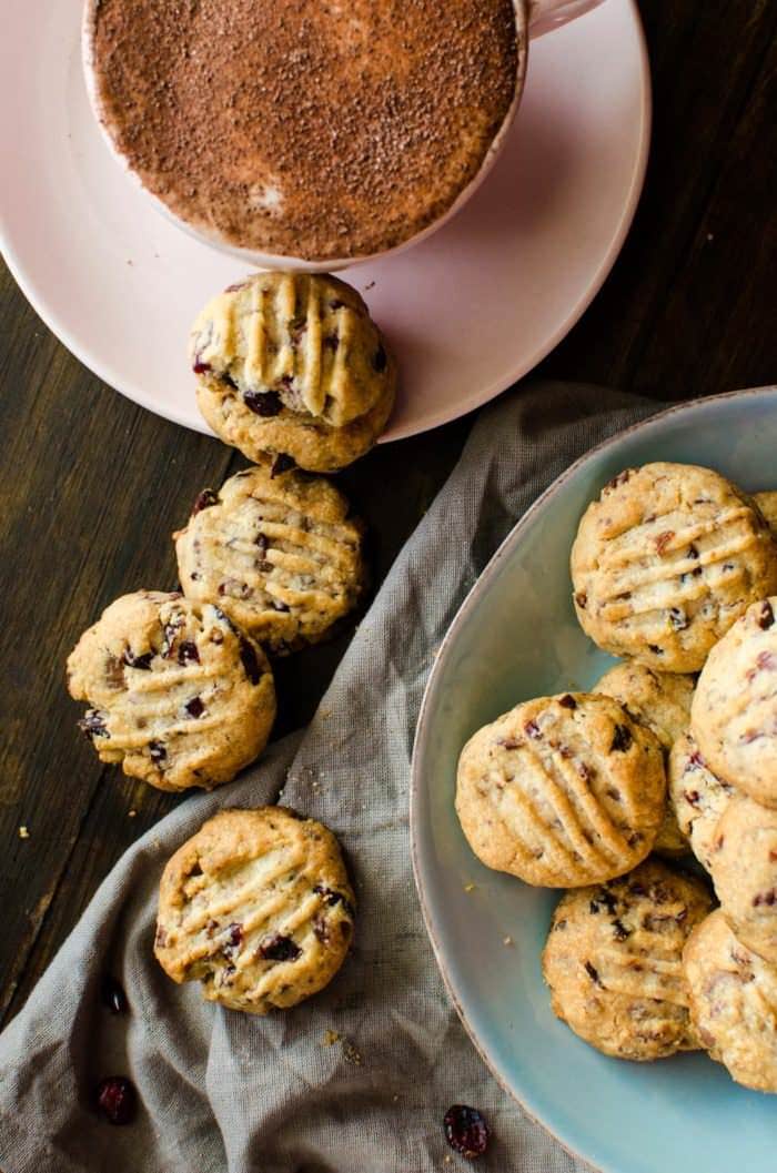 Chocolate Chip & Cranberry Shortbread Cookies - Crisp, buttery, crumbly shortbread cookies, studded with bits of milk chocolate and dried cranberries and spiced with warming spices like cinnamon, nutmeg and allspice, that are unbelievably (repeat, unbelievably!) easy to make and great for holiday baking! 