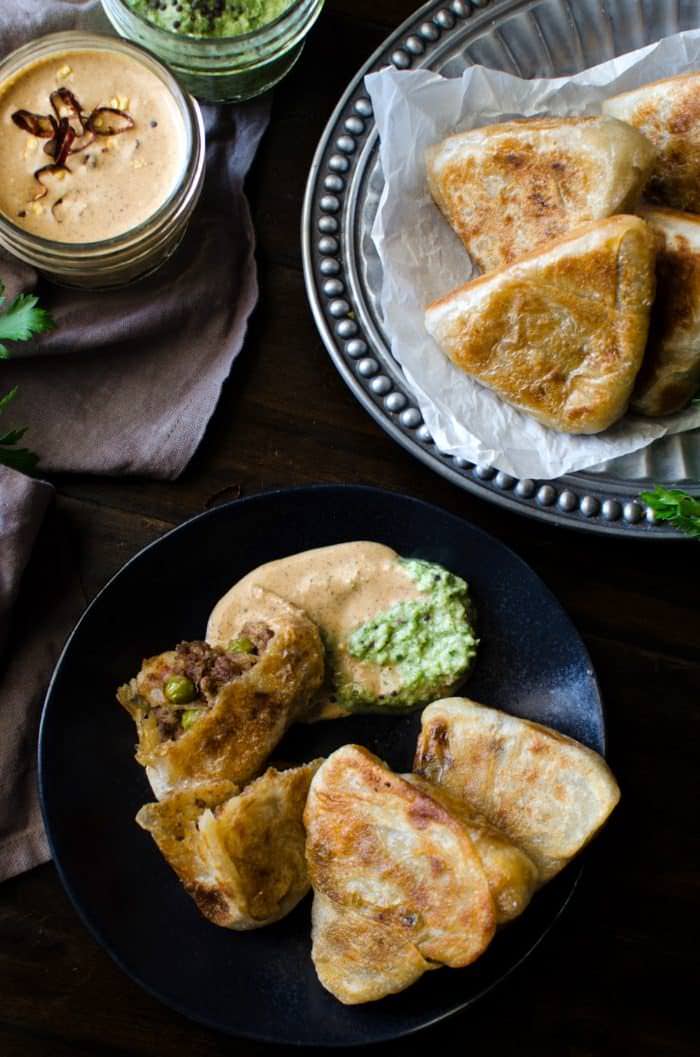 Curried Beef Roti - Now you can make snack sized Beef Stuffed Godhamba roti, a popular Sri Lankan snack, right at home. Spiced ground beef, wrapped in a thin soft roti and the perfect appetizer or party snack!