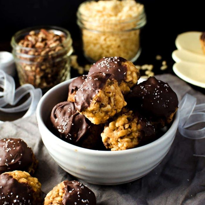 Chocolate dipped No bake Pecan Pie Cookies with Rice Krispies - pack all the nutty deliciousness of your fall-favorite pecan pies! Plus they make excellent gifts for the holidays too. Dairy-free friendly and vegan-friendly.