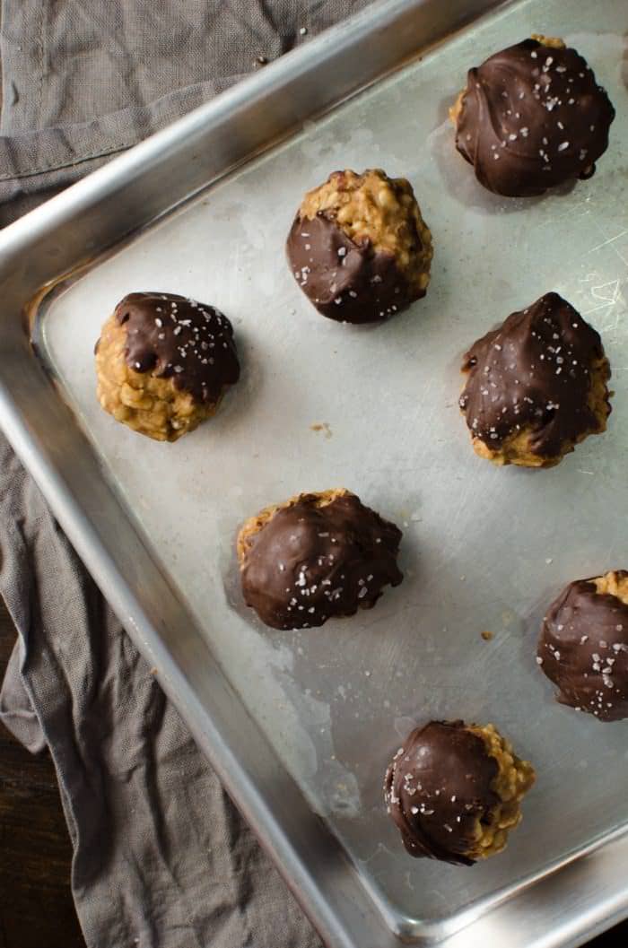 Chocolate dipped No bake Pecan Pie Cookies with Rice Krispies - pack all the nutty deliciousness of your fall-favorite pecan pies! Plus they make excellent gifts for the holidays too. Dairy-free friendly and vegan-friendly.