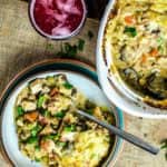 Creamy turkey shepherd's pot pie in a big white bowl, and another portion served in a smaller bowl.