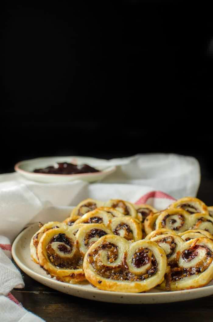 3 ingredient Berry and Cheese Palmiers - Crispy, crunchy, spicy, salty and sweet - these easy, cheesy savory palmiers are a delicious savory twist on the classic. Puff pastry, cheese and your favorite Fruit spread are all you need for this PERFECT party appetizer!