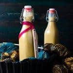Two bottles of toasted marshmallow creamer, with toasted marshmallows on the side.