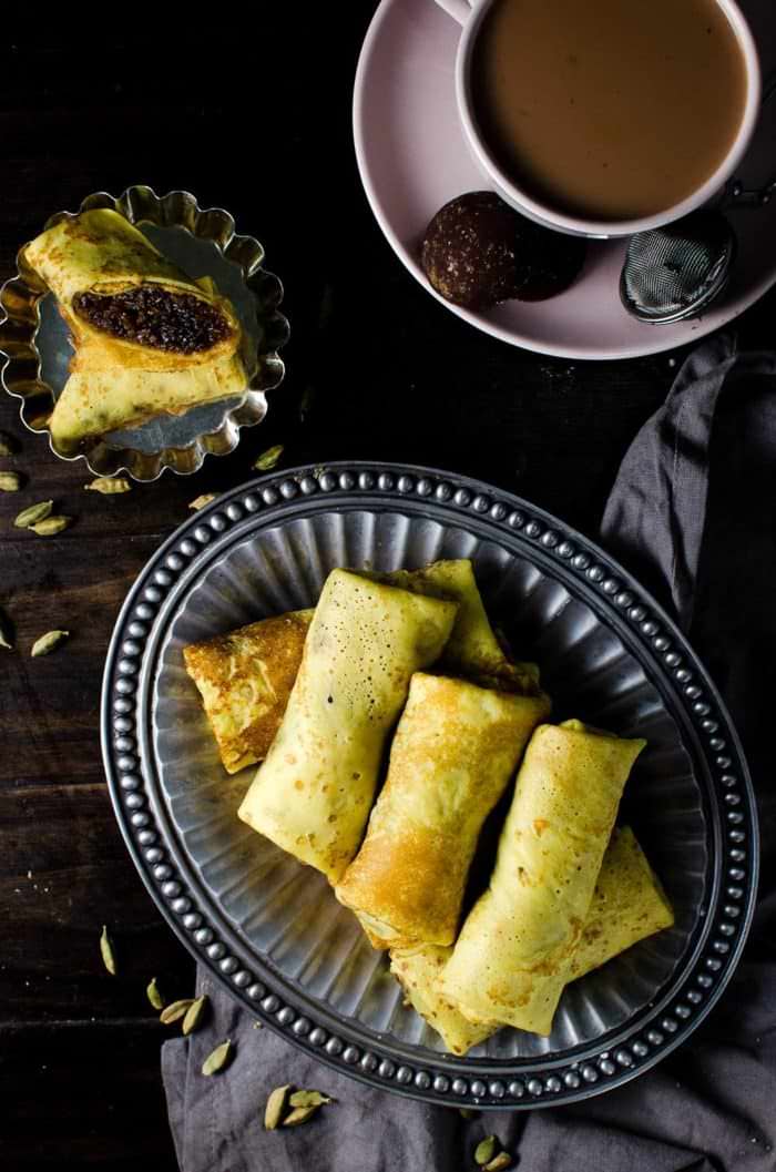 Sweet Coconut stuffed Crepes - Sri Lankan Pani Pol - Soft turmeric crepes, filled with a spiced sweet coconut filling. A Sri Lankan classic sweet snack loved by kids and adults. Perfect for tea time, parties, or simple dessert! A wonderfully, unique and delicious sweet treat that you will love!