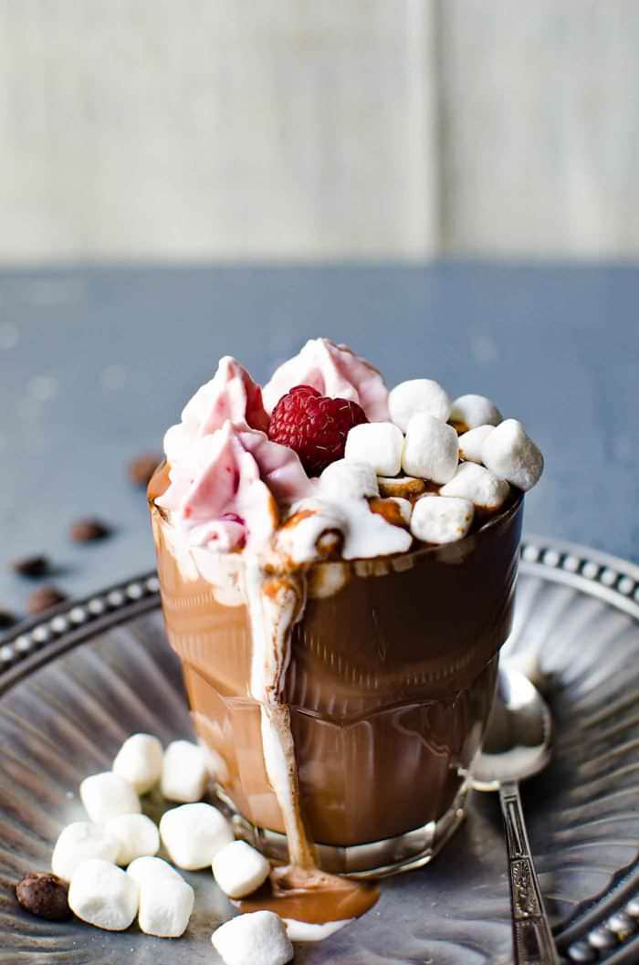 Parisian Hot Chocolate with Raspberry Whipped Cream - Only 3 ingredients to make this thick, luscious deep flavored hot chocolate, and topped with raspberry whipped cream. Enjoy hot chocolate, the way the French do!