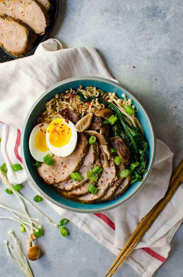 Easy Pork Ramen - Thinly sliced, perfectly cooked, juicy pork tenderloin and an egg with a gloriously runny egg yolk, crunchy Asian greens, and flavorful mushrooms, all swimming in a scrumptious and flavor-packed ramen noodle broth. All in less than 30 minutes! 