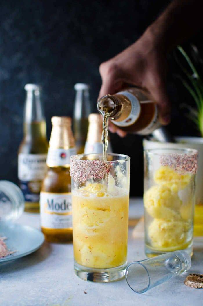 Frozen Pink Peppercorn Pineapple Margarita Shandy - The ULTIMATE summer cocktail, perfect for Cinco de Mayo! Pineapple and Pink Peppercorn sorbet with tequila. Top it up with ice cold Modelo or Corona Extra, for a fantastic beer cocktail!