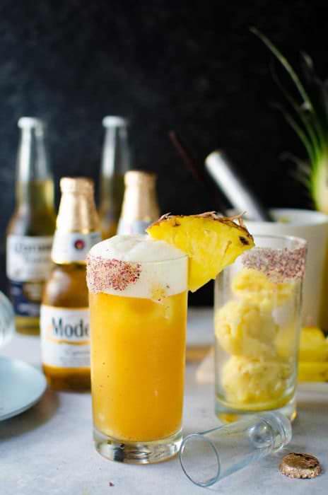 Frozen Pink Peppercorn Pineapple Margarita Shandy - The ULTIMATE summer cocktail, perfect for Cinco de Mayo! Pineapple and Pink Peppercorn sorbet with tequila and Modelo. A delicious twist on a Beer cocktail.