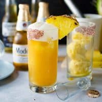 Frozen Pink Peppercorn Pineapple Margarita Shandy - The ULTIMATE summer cocktail, perfect for Cinco de Mayo! Pineapple and Pink Peppercorn sorbet with tequila and Modelo. A delicious twist on a Beer cocktail.