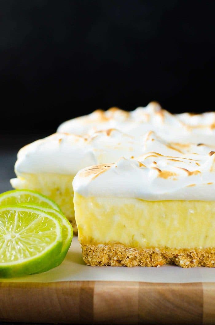 No Bake Frozen Margarita Pie Slice with a Pretzel crust - A boozy and refreshing summer dessert with perfectly balanced sweet, tart and salty flavors. Made with lime curd, and tequila this is a cocktail, a dessert and a summer fiesta in one glorious frozen margarita pie slice! And it's deceptively easy to make too!