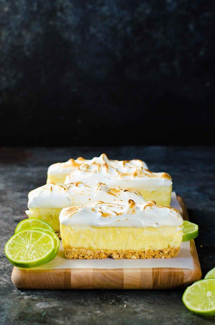 No Bake Frozen Margarita Pie Slice with a Pretzel crust - A boozy and refreshing summer dessert with perfectly balanced sweet, tart and salty flavors. Made with lime curd, and tequila this is a cocktail, a dessert and a summer fiesta in one glorious frozen margarita pie slice! And it's deceptively easy to make too!