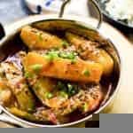 Cooked Sri Lankan mango curry with gravy in a stainless steel saucepan.