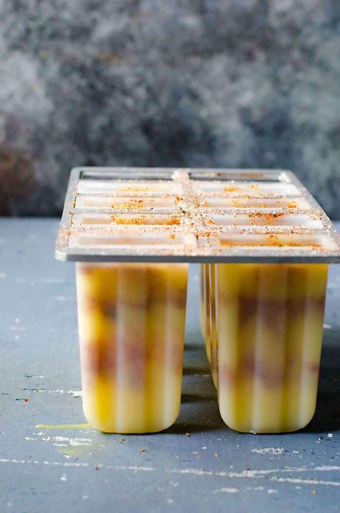 Spicy Pineapple Popsicles (Paletas) - layered with a spicy, salty spice mix that enhances the fruity freshness and sweetness even more! 